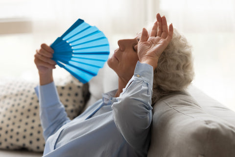 Woman experiencing hot flashes during menopause